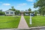 Located on a quiet double cul-de-sac in the highly sought-after Northport-East Northport School District, this fully renovated ranch-style home blends modern comfort with timeless charm. Set on a generous half-acre lot, every inch of this home has been thoughtfully updated inside and out. At the heart of the home is a stunning eat-in kitchen featuring quartz countertops, stainless steel appliances, a tile backsplash, and an open layoutâ€”perfect for everyday living and entertaining. The living room and den offer comfortable spaces to relax, the den highlighted by a cozy gas fireplace. Step outside in the spring and summer to enjoy the expansive paver patio with a built-in firepit, ideal for entertaining or unwinding under the stars. The spacious bedrooms provide a peaceful retreat at the end of the day, while the large basement offers flexible spaceâ€”perfect for a playroom, media center, or home gym. Recent updates include: Renovated bathrooms, gleaming hardwood floors, new windows and siding, upgraded heating and central air systems, 200-amp electric service, updated cesspool, paver walkway and custom paver driveway insertThis turnkey home is truly move-in readyâ€”just unpack and start making memories. Donâ€™t miss your chance to own a standout property in one of Long Islandâ€™s most desirable communities!