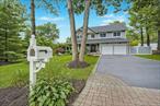 Welcome to this updated Center Hall Colonial, nestled on a shy half-acre of professionally landscaped grounds in the highly desirable Smithtown School District. A charming front porch invites you into a grand two-story entry, where gleaming hardwood floors flow seamlessly throughout both the first and second levels. The updated eat-in kitchen features ceramic tile flooring, maple cabinetry, a tile backsplash, and stainless steel appliances, including a double ovenâ€”perfect for effortless holiday cooking. A center island provides additional prep space, while the kitchen opens directly to the den, where a cozy stone-front wood-burning fireplace and sliding glass doors lead to the serene backyard. Large windows overlook the lush yard, allowing you to enjoy the view while preparing meals. The spacious formal dining room is ideal for hosting gatherings and special occasions. The large basement offers endless possibilities for additional living spaceâ€”whether a home gym, media room, or playroom. Upstairs, you&rsquo;ll find generously sized bedrooms perfect for unwinding after a long day. Additional highlights of this exceptional home include: Recessed lighting (hi-hats), 200-amp electrical service, updated bathrooms, first-floor laundry, updated windows, roof, heating system, central air, and central vacuum systemDonâ€™t miss the opportunity to make this move-in-ready home your own!