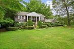 Spacious 6-Bedroom Colonial located in a prime Dix Hills setting within the Half Hollow Hills School District. This generously sized home offers a fantastic opportunity for those looking to renovate and make it their own. Featuring a bright eat-in kitchen with granite countertops, a formal dining room, and an oversized living roomâ€”ideal for entertaining. The inviting family room includes a fireplace and sliding glass doors leading to the backyard. The expansive primary suite offers a full bath and walk-in closets. Hardwood floors run throughout the home. A full, oversized basement provides endless potential for additional living space or storage. Outdoors, enjoy a deck off the kitchen, a patio, a shed, and a fire pit on a partially wooded acre. The home also includes separate guest quarters with 2 bedrooms, 1.5 baths, a living area, and a kitchenâ€”perfect for extended guests or multi-generational living. A long driveway provides ample parking. Conveniently located near parks and schools, this home combines space, flexibility, and prime locationâ€”ready to be reimagined.