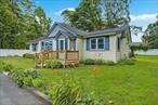 This charming ranch-style home, located at the end of the street in the highly sought-after Smithtown School District, offers inviting curb appeal and comfortable living. Step inside to a spacious living room, perfect for relaxing or entertaining guests. The eat-in kitchen provides ample space for meal prep and casual dining, with direct access to the yard for seamless indoor-outdoor living. Enjoy the bonus den, featuring sliders that lead to the backyardâ€”ideal for summer barbecues and outdoor fun, with a large grassy area perfect for games and gatherings. The generously sized bedrooms offer a peaceful retreat after a long day. Additional highlights include updated bathrooms, central air for year-round comfort, and a convenient door from the kitchen to the yard. A PVC front fence adds privacy and style to the homeâ€™s exterior.Donâ€™t miss this opportunity to own a home with both charm and function in a desirable location.