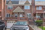 Welcome to this solid single-family brick front porch townhouse located in the desirable Middle Village Community. This home features on the 1st floor a spacious living room, eat -in - kitchen and dining room. The 2nd floor consists of 2 bedrooms, and a full bathroom. Finished basement consists of recreation room with door to private yard, laundry room, garage access. Home has mini split AC units, hardwood floors throughout, one car garage. Located near local shopping, transportation, and Juniper Valley Park. Must see!