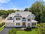 Exclusive New Construction offered by a premier local Scarsdale luxury developer! This meticulously crafted designer shingle style residence is located in a charming, picturesque Heathcote, Scarsdale neighborhood. set on a half-acre of private property and offers brilliant features. Main level offers a spacious, natural light filled open concept modern floor plan with living room, family room, and dining room offers flexible use of all entertaining spaces. Breathtaking sun drenched luxury chef kitchen, with custom inset cabinetry, high end appliances, large island, eating area, pantry, butler/bar area, open flow with large family room, with beamed ceiling details. Beautiful double sliding glass doors open to a large outdoor covered and uncovered deck area, Study/Library/Music room with vaulted wood ceiling and impressive oak shelving, stunning powder room. mudroom with custom millwork, express laundry, private first floor bedroom en-suite,  Spectacular large entryway with vaulted ceiling, open tread oak stairs to upper level. Second level offers a private primary suite with a breathtaking cathedral ceiling, dual customized closets and luxurious European spa bath with impressive ceiling details, and a large private balcony, Private en-suite secondary bedrooms customized for different personalities. Large laundry room. Hallway reading/study area with oak built-ins. Lower level is optimal for entertainment and relaxation with a large recreation room with a bar area, soundproof media room, exercise room, bedroom quarters, and storage. Oversized insulated, heated garage with EV wiring. Full walk up attic storage space. Spacious grounds, private, nestled with exquisite plantings, optimized for entertainment and family enjoyment in a tranquil outdoor paradise, large open deck, covered porch area, and room for 20x40 pool, Innovative contemporary wall and ceiling finish details throughout this completely turnkey luxury residence. Designed with passion, built with surgical precision, every high-end feature and unique finishes imaginable, state of the art technology, built with locally renowned architectural and engineering services. Ideal for young growing extended families. Walking distance to Heathcote School, Five Corners, Golden Horseshoe, houses of worship, close to the train station, 35min to NYC.