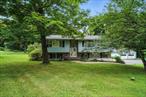 Welcome to 2217 State Route 300, a legally zoned two-family raised ranch nestled on 1.9 acres in the desirable Wallkill School District. Currently used as a spacious single-family home, this versatile property is perfect for multi-generational living or as a smart investment opportunity. The upper level offers 1, 332 sq ft of living space, featuring 3 bedrooms including a primary suite with a private full bath, a bright living room, an eat-in kitchen with access to a large back deck, a dining area, recessed lighting, vinyl and ceramic tile flooring, central air conditioning, and a half bath with laundry room located on the lower portion of the main unit. The lower-level apartment offers an additional 860 sq ft and includes a separate entrance, 1 bedroom, 1 full bath, a living room, and a kitchen area with hookups ready for easy reinstallationâ€”ideal for extended family or rental income. The property includes a one-car attached garage, a detached two-car garage with electricity, a paved driveway with ample parking, and a beautifully landscaped, level yard surrounded by mature trees. Conveniently located near Newburghâ€™s shopping centers, the Hudson River waterfront, I-84, I-87, Stewart Airport, the Beacon-Newburgh Bridge, and the Metro-North Ferry, with easy access to local villages, hiking trails, wineries, and popular Hudson Valley destinations like Mohonk Mountain House and Minnewaska State Park. Just about an hour from NYC, this duplex-style home blends town-and-country living with flexibility to suit a variety of lifestyles and needs.