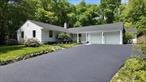 This immaculately renovated Ranch is set on 2.86 acres down a long and tree-lined private road, one-third of a mile off Woodbury Road. Boasting a bright and airy formal living room with a bay window, built-in cabinetry and patio doors, this charming residence also has a lovely formal dining room with an additional patio door to the exterior. The thoughtfully remodeled kitchen features custom cabinetry, quartz counters, a farmhouse sink, stainless-steel appliances, a large dining space, laundry area, beautiful powder room, and access to the 2-car garage. The master suite offers a spacious bedroom with picturesque views, double closets, and a spa-like master bath. The additional bedrooms are both large with ample closet space, and there is a tastefully appointed hall bathroom with a dual vanity. Highlights include refinished hardwood floors, freshly remodeled kitchen with new appliances and baths with gorgeous new fixtures, plus new windows, doors, roof, and HVAC. This incredible home features a park-like property with mature specimen plantings and plenty of space for a pool. Centrally located, this residence is close to historic Cold Spring Harbor and Huntington village which both offer a myriad of restaurants, shopping, parks, beaches, golf courses, and boating options. RE Taxes $22, 709.83 Road Fee $750. /Quarter.