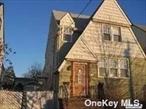 Rare legal 2 family home located in the Hewlett-Woodmere school district #14. Beautifully maintained with many updates. Mid-block location. Very long driveway and garage. Recent updates include a new Burnham gas boiler installed in 2021, A new Timberline 50 year roof installed in 2021 along with new gutters and leaders. New driveway installed in 2023, Cambridge pavers on the walkway and driveway border installed in 2023, Skylight and freshly painted. Washer and dryer in both apartments. Low taxes make this home a must see.