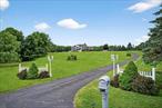 Hilltop Colonial with Breathtaking Views on 9.2 Acres in the Paddock Farm Area. Imagine waking up each morning to golden sunlight pouring through oversized windows, views stretching for miles, and the quiet stillness of nature all around. Set atop a private cul-de-sac in the desirable Paddock Farm area, this elegant Colonial offers a lifestyle where every day begins and ends with peace and beautyâ€”and where the drive home feels like a retreat. Set on 9.2 spectacular acres with panoramic countryside views, this home is filled with warmth, space, and thoughtful details. The open-concept kitchen features sleek, young LG stainless steel appliances, a commercial-grade hood, and a bright breakfast room. French doors lead to a private main-floor office, and the family room invites you in with vaulted ceilings, a wood stove, and a built-in sound system that stays. A formal dining room with a statement chandelier makes entertaining easy and elegant. Step outside to enjoy a stamped concrete patio, a pool with a sun deck, and a backyard dotted with fruit treesâ€”including apple, pear, plum, cherry, and Korean pear. Whether you&rsquo;re lounging by the pool or walking the grounds, there&rsquo;s a sense of space and serenity that&rsquo;s hard to find. Upstairs, the primary suite is a standout, with a sunlit turret, double vanities, a spa-like bath, and a huge walk-in closet with its own window. Three additional bedrooms each offer peaceful views, natural light, and plenty of charmâ€”including a generous guest room with Palladian windows. Additional highlights include a Nest-controlled four-zone heating and central air system, negotiable furnishings, beautiful curtain rods and blinds, and a finished basement with a CO, propane fireplace, dry bar, and egress. The septic system was pumped in 2021â€“2022 and the home includes a water softener and pressure system. And at the end of the day, thereâ€™s nothing quite like settling into this homeâ€”watching the sun set over the trees, surrounded by quiet, and feeling lucky to call this place your own. A rare opportunity in the Pine Bush School District, this is a property that truly lifts your spiritsâ€”morning, noon, and night.