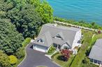 Move Right In and Soak Up the View, Where Every Day is a New Experience! Check out this Stunning 5 bedroom, 3 1/2 Bath, Post Modern residence. Perched 100 feet above Sea Level on the Bluffs of Miller Place with Unobstructed Year-Round Views to Connecticut across Long Island Sound!â€¦Welcome to this 3650 square-foot, (Smoke Free/Pet Free), Designer Appointed Waterfront home with Professionally Curated Interiors Reflecting High-End Finishes and Elevated Style. Including Deeded Beach rights, Soaring 25 foot ceilings in the Living Room, and Water Views from every room. The rest of the Professionally designed interior has 9 foot ceilings, Recessed Lighting, Custom Moldings, and Smart Security throughout with a Full 9â€™ Ceiling Basement. â€¦Host In Style in the Professionally Appointed Chefs Kitchen, designed for both Gourmet Cooking and Elegant Entertaining. Featuring a premium 6 burner Gas Cooktop, 2 Ovens, Custom Cabinets, Center Island Butcher Block. Built-in Beverage Cooler â€“ perfect for entertaining and every day living. Soaring 25 foot ceilings create a Dramatic, First Impression in the Living Room where expensive sliding Glass Doors frame the Panoramic Views of the Long Island sound. A Sleek Gas Fireplace adds warmth and ambiance Seamlessly connecting the Indoor Space to the Waterfront Patio beyond. .The Luxurious Primary Suite includes Fireplace and Private Patio access with Electric Remote Powered Shades to open up after you wake to catch the Sunrise. Of Course the Walk-in Closet and Two Additional Wardrobe Closets provide ample Wardrobe Space! The Spa Inspired En Suite features double sinks, with custom designed countertop, Spacious Enclosed Shower with a handheld wand , Body Jets for a luxurious experience ands private Water Closet for added privacy. Outdoor living shines with your private Oasis showcasing a 2 Level Paver Patio, Built in Kitchen w 2 mini fridges, Sink, Granite Countertop. A cozy Fire Pit, Secret Garden, Raised Bed Herb Garden & Outdoor Shower-All set against the backdrop of breathtaking views! The Private Community Beach includes Lifeguards, Security Patrols, Beaches, Sanctuary and Social Events. â€¦Built for peace of mind, this Home features a VERY Strong $$$ Engineered Composite Sea Wall, Low Maintenance Vinyl Siding, Impact Rated Hurricane Windows, Smart Drainage system and a Auto Standby Generator with Underground 500 Gallon Propane Tank, Keeping you protected and worry free in any weather.  Move right into this Show Stopping Coastal Retreat. Steps away from the shoreline and moments to the marina â€“ where every day feels like a vacation! Taxes on MLS are the True taxes. Some other sites may have it wrong.