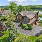From a renowned local builder, in the exclusive private cul-de-sac of Fieldstone Court, this contemporary colonial overlooks the serene Lake Deforest. Boasting 5 bedrooms, 5 baths, an open design, spacious patio & in-ground pool, this home sits on .69 of an acre of finely landscaped grounds, with lake views throughout the home year round. Step inside to a grand atrium that flows effortlessly into dual living rooms united by a wet barâ€”perfect for hosting. The expansive dining room, is adorned with two sets of French doors. The spacious kitchen boasts a dine-in area, high-top bar, Culligan water purification system, garbage compactor, and a versatile island equipped with an additional sink, built-in grill top, and food processor-all opening to the generous porch and poolside retreat. Cozy up at one of the two fireplaces and enjoy this vacation style home. The basement includes another estimated 1800 sqft of space with walk out access to the patio and pool. Additionally, the garage is wired for EV charging! Ideal for commuters â€” the breathtaking views will make you forget youâ€™re just minutes away from New York City. New City features award winning schools,  fine dining experiences, shopping, outdoor activities, local parks, and easy access to major highways for an easy commute to anywhere.