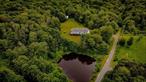 Easy one level living on this 10.3 acre private, quiet retreat close to Roscoe, NY. This 3 bedroom, 2-1/2 bath ranch of 1, 620 square feet is 15 minutes from the amenities of a quaint upstate town yet so tranquil it will allow you to relax and enjoy life! Sit on your wrap around porch and take in the serene freshwater pond teeming with wildlife. Finished lower level and 2 car oversized garage. 24x24 barn with enclosed fencing perfect for a small experience with farming. The land is level and heavily treed to provide privacy from neighbors. Low Delaware County taxes. Small annual HOA fee for maintenance of private road. You&rsquo;d be hard pressed to find another property as perfect as this one. 8.3 miles to Roscoe with restaurants, gas, shopping, fishing, link to major transportation. Minutes to unparalleled fishing in the Pepacton Reservoir or the Beaverkill. Come enjoy the ultimate lifestyle in the Catskills!