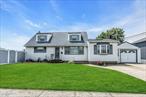 Nice! Expanded, 4 Bedrooms, 2 Full Baths, Family Room, Formal Dining Room, Full Basement & Garage.