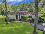 Steeped in history and filled with love, this charming expanded ranch has been home to the same family since it was built in 1940 â€” four generations of memories made here. Now, itâ€™s ready for a new chapter!Situated on a corner half-acre lot, this 3-bedroom (with a possible 4th), 3-bathroom home offers approximately 1, 800 sq ft of living space and plenty of room to grow. The land next door is a protected natural sump, so youâ€™ll never have neighbors right beside you â€” just peace, privacy, and plenty of rabbits to watch from the spacious back deck.Inside, youâ€™ll find a big eat-in kitchen, a large dining and living room combo perfect for gatherings, and two ensuite bedrooms on opposite sides of the house â€” ideal for privacy or multi-generational living. With central air, in-ground sprinklers, newer appliances, and rental potential (with proper permits), thereâ€™s so much to love here.While it could use some updating, this home has been lovingly cared for through the years. Whether youâ€™re hosting friends on the huge deck, enjoying the half-acre of property, or simply soaking up the quiet charm of the neighborhood, this is a place to make your own memories.Donâ€™t miss your chance to write the next story in this beloved homeâ€™s history!