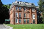 Beautiful riverfront SOHO style loft in converted 1800s brick schoolhouse facing the Hudson River, close to train, restaurants, riverfront, marinas, summer concerts on the river and all that glorious Hudson Valley riverfront life has to offer. Enjoy one level living in this fabulous open plan unit at the best corner spot in the building, with 14 foot ceilings and 10 foot windows, facing the Hudson to the west, with stunning sunsets and glorious light, which glistens off the hardwood floors. This unit has plentiful closets, a newly renovated primary bath, and a marble and terrazo hall bath. The loft bed built into second bedroom allows for use as a bedroom or as an office below and sleeping above. This prime location condo has no-steps access from the first floor lobby secure entry via the elevator to the second floor, plus additional access directly from rear parking lot, only four steps up to the hallway from the unit. The 12-unit elevator building has only three units per floor, providing quiet and a sense of privacy. The huge private front yard overlooking the Hudson can be enjoyed in all seasons. In addition, there are front and rear parking lots plus additional land owned by the complex. Unassigned parking for two cars is included. It&rsquo;s only a five minute stroll to the Metro North train, 50 minute express to NYC. Living is so much easier than in a house, and much more private than in a typical apartment building. The condo takes care of landscaping, snow removal, garbage pickup and maintenance. It&rsquo;s a great lifestyle, close to the aqueduct trail, the Ossining Farmers Market, great restaurants and pubs, Croton Point Park, the Croton riverfront and other nearby Hudson riverwalks and marinas, SingSing Kill brewery, and one of the best lifestyles in the metro area, You can OWN and enjoy this fantastic quality of life in one of Ossining&rsquo;s most noteworthy historic buildings for less than it costs to rent!! Taxes with STAR only $4047 (approx).For you history buffs: The Vireum School for Boys was founded in 1870 by Major Henry C. Symonds, a former West Point English professor who was married to Beatrice Brandreth, a daughter of Benjamin Brandreth, builder of the Brandreth Pill Factory down the street from The Vireum. Established as a college preparatory school geared toward preparing school-aged young men for entrance into military academies, the school sent several hundred graduates on to schools such as West Point and Annapolis during its years of operation. It was restored in 1988 and adapted for residential use. Always wanted a SOHO loft? Here&rsquo;s your chance, with river views and a much easier lifestyle than you could have in NYC!!CURRENTLY FURNISHED DIFFERENTLY THAN ILLUSTRATED HERE. Virtually staged photos to inspire - you do you!