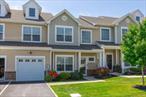 Welcome to The Vineyards at Blue Point! This beautifully upgraded Corsica model offers 3, 388 sq. feet of luxurious living in a premier 55+ gated community featuring clubhouse and pool. Situated perfectly on the pond this home was built in 2017 and boasts a 1st floor primary en suite, designer kitchen with granite countertops, custom cabinetry, and stainless steel appliances. The Main level also includes a formal entry, formal dining room,  formal living room with a gas fireplace, powder room, and 1 car garage. Upstairs you will find a spacious Den, large second bedroom and full bathroom, while the fully finished basement includes a 3rd full bath and abundant room for guests, hobbies or home theatre. Enjoy the outdoors from your custom paver patio with awning, Additional features include: gas heating, Central air, and custom light fixtures throughout. Low Taxes of $9167 per year and HOA $575 monthly. Don&rsquo;t miss this rare opportunity to own a prime unit in one of Long Islands most desirable 55+ communities!