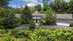 Set on over an acre of beautifully curated and private grounds, this exceptional residence offers the rare opportunity to own a sophisticated, sprawling home in one of Scarsdaleâ€™s most coveted estate neighborhoods. Designed for both elegant entertaining and serene everyday living, this property masterfully blends timeless European-inspired architecture with modern comfortsâ€”all just minutes from downtown Scarsdale, award-winning schools, and the Metro North express train to Manhattan.A grand circular stone foyerâ€”evocative of a French country estateâ€”welcomes you with grace and architectural presence. From there, a barrel-vaulted center hallway with soft cove lighting sets the tone for the homeâ€™s refined aesthetic. At its heart lies a stunning great room with oak floors, a wood-burning fireplace, and 2 sets of French doors opening to an expansive bluestone patio and sweeping backyard vistas. Framed by oversized windows on three sides, this light-filled space offers uninterrupted views of lush, manicured lawns, mature trees, and extraordinary specimen plantings.The formal dining room is richly detailed with hand-painted murals, providing a warm and elegant setting for dinner parties and holidays. A step-down family room with built-in cabinetry offers a relaxed yet polished space for reading, movies, or casual gatherings.The French country-style kitchen combines charm and function, with tiled floors, custom cabinetry, and a sunny breakfast area. Multiple doors lead out to a secondary patioâ€”perfect for al fresco dining or morning coffee amid the gardens. A spacious laundry and mudroom provide practical ease, and the attached two-car garage offers direct entry.The luxurious primary suite occupies its own private wing, offering a true sanctuary. It includes two walk-in closets, a marble-clad spa bathroom with Jacuzzi tub, separate glass shower, dual vanities, and natural light from overhead skylights. An adjoining bonus room, currently used as a fitness space, features a full wall of windows and direct outdoor accessâ€”ideal for a home office, yoga studio, or peaceful retreat.The home offers flexible accommodations with two additional generously sized bedrooms and a full hall bath located in the family wing. A fourth bedroom and full bath, privately situated on the opposite end of the home, provide ideal quarters for guests, an au pair, or live-in support.The lower level expands the lifestyle offerings with a spacious recreation room (including a pool table), private office, and extensive storage areas. A charming powder room on the main level, a whole-house generator, and thoughtful custom features throughout add to the propertyâ€™s luxury appeal.Outdoors, the estate-like setting is a true highlightâ€”expansive, level lawns, multiple patios, and professional landscaping and lighting create a secluded oasis for relaxation, entertaining, or play. Whether youâ€™re hosting a garden party under the stars or enjoying a quiet morning among the trees, the outdoor space is as refined and peaceful as the interiors.Meticulously maintained and lovingly expanded by its current owners, this home offers discerning buyers a truly rare opportunity: a grand and gracious residence with the ease of one-level living, surrounded by nature and elegance, in a location that balances privacy and proximity. The home boasts of fine building materials including 200 amps /3 phase electric service  Enjoy all that Scarsdale has to offerâ€”top-ranked schools, fine dining, boutique shopping, and effortless access to NYCâ€”while living in one of the most exclusive and established enclaves in Westchester.51 Park Road is assessed by Scarsdale at full market value of $3, 322, 902.Come for a visit and make this one-of a kind masterpiece your home.