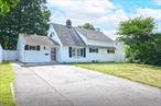 Move right into this expanded 5 bed, 3 bath ranch with 1, 612 square feet in the Island Trees section of Levittown! The first floor features a granite eat-in kitchen with tile backsplash and overhead lighting, formal dining/living room with laminate vinyl flooring, an extended primary bedroom with large tile full bath, big closet, and wall A/C, two additional bedrooms (one perfect for a home office), an extended sunroom, and another full tile bath. Upstairs offers two more bedrooms and a full bath. Additional highlights include potential for mother-daughter setup with proper permits, updated windows, new insulation and electric, newer boiler, oversized lot, private 2-car driveway, inground sprinklers, and a fully fenced backyard with patio. Low taxes!