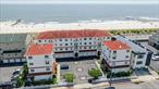 Beachside, bright & beautifully updated UPPER townhouse condo. 3 bedroom, 2.5 bath. Parking for two- private garage + assigned parking spot. Unique free-standing tower unit with North, South, East & West views & only two units per tower in this 16-unit oceanfront complex. Ocean, beach & boardwalk views, from the main living area as well as top floor. 2100 sq ft. Two west facing balconies with ocean & boardwalk & city views. Well thought out state-of-the-art renovations throughout. High-end updated mechanicals. Redesigned award-winning kitchen with 10â€™ island (seats 12) with addâ€™l storage beneath. Top floor primary bedroom with: walk-in closet, ensuite large full bath w/ soaking tub for two & separate shower, double vanity & sinks, new Anderson windows, sliding doors to private upper deck. Full size washer/dryer in hallway laundry area. Semi-private elevator & stair access. Dual zone heating, central air, & radiant heat. Whole house water filtration, kitchen has additional under sink water filtration. Plenty of storage from the garage w/ 15â€™ ceilings, lofts, crawl space (cement floor) & additional storage systems/areas to the full attic up top. Direct boardwalk access through private gate w/ key, near outdoor shower for after beach. Access to boardwalk is close to beach entrance. Conveniently located, close to all shopping, LIRR and a quick commute to NYC. You must come and see this in person.