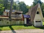 This unique cottage is located by a quiet lake. Besides the two bedrooms and kitchen, living room, bathroom. there are so many potentials to discover! An extra tiny room for any convenient use. Extra space on top of the garage with a bathroom. A sewer system included there for you to make it work. It&rsquo;s marked as seasonal residence , but owner says it has everything for winter. A few parking spaces are created in front. There is a shed for fishing by the lake. It&rsquo;s up to buyer to verify all information.