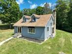 This cozy 3-bedroom, 1.5-bath Cape Cod sits on a peaceful private road in the highly sought-after Minisink School District.From the moment you step inside, youâ€™ll notice craftsmanship that speaks volumes. Check out the remodeled kitchenâ€”itâ€™s a cookâ€™s dream with granite countertops, stylish shaker cabinets, and a gas cooktop and double wall oven that makes hosting or weeknight meals a breeze. Perfectly positioned just off the kitchen is a renovated half bath that adds both daily convenience and entertaining ease to the home. Whether you&rsquo;re hosting guests or need a quick stop during the day, this powder room is exactly where you want it.Exposed wood beams add a sense of warmth, history, and charm. In the heart of the living area, a stone fireplace stands- solid, elegant, and designed to bring people together. Whether youâ€™re entertaining or enjoying a quiet evening, it delivers a cozy sense of timelessness. Underfoot, youâ€™ll find durable vinyl-planked flooring â€” a smart, stylish upgrade that handles daily life with grace. Itâ€™s the kind of flooring that looks great and lasts.Upstairs, you&rsquo;ll find three bedrooms. Each one is outfitted with signature Cape Cod built-in storage, making the most of every square foot. Efficiency and charm, working hand in hand. And letâ€™s not overlook the beautifully remodeled full bathroom â€”With dual entry points â€” one from the main hallway and another directly from the primary bedroom. A thoughtful renovation that has both style and functionality, adding ease without sacrificing character. The finished basement adds even more usable spaceâ€”perfect for a game room, movie nights, or a quiet home office. Outside, enjoy your morning coffee on the slate patio while listening to the peaceful stream that runs through the backyard. Thereâ€™s a detached 2-car garage with electric, a large partially paved driveway, a big yard for pets or play, and so much room to grow.Plus, the home is part of a private road with a maintenance agreement, so you get that quiet country feel without the hassle. Homes like this donâ€™t come around oftenâ€”especially in Minisinkâ€”so donâ€™t wait too long to take a look! Check out the virtual tour.