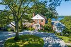 Eagleâ€™s Beak, a Magnificent Estate in Cold Spring Harbor with Incredible Western Sunsets- a timeless, classic brick residence overlooking Cold Spring Harbor commands 180-degree panoramic water views. The house, designed by noted architect Aymar Embury, is perched above the harbor on 3 .5 acres of lovely private grounds, with specimen trees, a gunite pool, a walled rose garden and a charming two bedroom guest house. The residence was completely renovated and beautifully executed with superb quality & traditional details. Large sundrenched principal rooms grace the interior. The living room, den and formal dining room feature custom fireplaces, exquisite millwork, hardwood floors & incredible sweeping water views. The gourmet kitchen is tastefully designed with custom cabinets, marble countertops, high end appliances, and a delightful breakfast nook overlooking the water. A charming den with a wood burning fireplace leads to the first-floor primary suite which features a large dressing room, custom closets and a luxurious marble bath. Adjacent to the primary suite is an additional bedroom or office, and a sunny conservatory. Upstairs, there are three beautifully appointed bedrooms, two recently renovated full baths, and an office. The lower level has plenty of space with room for recreation and storage. Estate includes the option to purchase 3 water view/waterfront lots and include approximately one-quarter mile deeded beach on beautiful Cold Spring Harbor, Whole House Generator 5 Zones Heat 5 Zones Central Air Conditioning In-Ground Sprinkler System In Ground Gunite Pool, Eagle Dock Beach and Mooring Rights (Dues Required), Lloyd Harbor Village Park and Camp and Mooring (Dues Required),  Cold Spring Harbor School District SD#2.