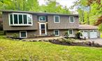 Clean, Fresh & Private! Move in Condition! 4 bdrms, 2 bths, Oversized 2 car garage, Over 1 acre w/lake view! Many updates -Kitchen appliances, washer/dryer, light fixtures, refinished hardwood floors, electric fireplace/heater, expansive deck, . Chef&rsquo;s kitchen w/tons of storage, maple cabinetry, granite counter tops w/sliders to the deck and private back yard. Entertainers Delight!!! Updated lower level w/wood flooring - feels like 2 houses in one! Great for extended guest, game room, office, exercise area or anything else! Separate Laundry Room, Newer vinyl siding, young roof, tons of natural light beaming through the functional double skylights. Set between Lake Mombasha & Lake Winape in park like neighborhood, yet easy access to trains, buses & highways. Near state park, hiking trails, shopping & schools. Monroe-Woodbury Schools.