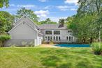 An Exceptional Opportunity in East Hampton&rsquo;s Northwest Woods Set on three private, parklike acres in the coveted Grassy Hollow Estates, this stately post-modern offers 3, 000&#177; square feet of soaring architecture, abundant natural light, and gracious living-all just minutes from Sammy&rsquo;s Beach, Cedar Point Park, East Hampton Village, and world-class ocean beaches. A dramatic double-height foyer makes a striking first impression, leading into a sun-filled great room anchored by a grand fireplace, framed by walls of glass, and lined with six farmhouse-style French doors that open to the expansive backyard and 20&rsquo; x 40&rsquo; heated in-ground pool. Designed with entertaining in mind, the open-concept kitchen flows seamlessly into formal living and dining areas, creating effortless indoor-outdoor living. The spacious main-level primary suite features a newly renovated marble bath with soaking tub and shower, a large walk-in closet, a private boudoir with vanity, and the second of the home&rsquo;s three fireplaces. Just off the great room, a charming windowed den with the third fireplace provides a cozy retreat or ideal work-from-home space. A full bath and powder room complete the main level. Upstairs, two oversized guest bedrooms each offer walk-in closets and share a full bath (ensuite to one), while a bonus room above the garage provides flexible space for a gym, office, or additional guest quarters. The 1, 754&#177; sq. ft. lower level offers untapped potential-ready to be finished and expand the home&rsquo;s total living space to nearly 4, 700&#177; sq. ft. On a lot of this size and privacy, you can expand the house up to 10, 620 sq. ft. and add your own tennis and pickleball courts-an increasingly rare opportunity in today&rsquo;s East Hampton market. Offered as is, 2 Old Hollow Lane presents a rare chance to update or reimagine a home with excellent bones, dramatic volume, and true architectural presence-all on a prime parcel in one of East Hampton&rsquo;s most desirable neighborhoods. A must-see for buyers seeking privacy, scale, and upside potential in the heart of the Northwest Woods