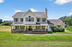 With over 3, 000 sq ft of living space and set on 7.5 open, level acres, this sun-filled Colonial delivers unbeatable value, inside and out. From the moment you arrive, you&rsquo;re greeted by wide-open skies, sweeping lawn, and views that stretch as far as the eye can see.This home has been lovingly maintained by caring owners and offers a thoughtful layout ideal for both everyday living and entertaining. The main level features a huge, comfortable family room, formal living and dining areas, a spacious kitchen with island seating, a laundry room, and a powder room. Upstairs, the oversized primary suite includes a luxurious bathroom with a jetted tub and separate shower, plus three additional generously sized bedrooms and another full bathroom.Storage is plentiful with a full walk-up attic and a walk-out basement with access to the sprawling backyard. Enjoy morning coffee or evening sunsets from the deck, surrounded by nothing but green and sky. There&rsquo;s also a covered patio below and a 2-car garage, with ample parking on a long driveway.Located on a quiet cul-de-sac street just minutes from schools, shopping, and town conveniences, this is a rare opportunity to own a home with land, views, and space to grow.