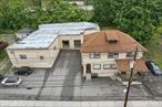 Mixed Use Building in the heart of downtown Suffern. This is a very rare find. Two warehouses with front offices and two, 1 BR, 1 BA residential units. Two Loading docks, 1 Drive-In Door and attached private parking lot. Tenants are all long term, but current Owner will not issue leases, so this is an amazing opportunity for an Owner / User as well as an Investor. The commercial units are separately metered for gas, electric and water. The residential units are separately metered for gas and electric.