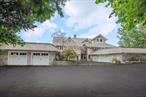 Stunning waterfront manor on almost 3 acres overlooking the Long Island Sound With private beach steps to your own Beach! This is more then just your average home, this home is a one of a kind custom build with multiple levels and balconies at every turn. When you walk into your entry hall with granite flooring and winding staircase you&rsquo;ll come up to your Living room and dining room with parquet wood flooring and fireplace. The custom kitchen cabinetry has granite countertops and high-end appliances. There is 2 bedrooms separated by a full bathroom on this floor as well as a den with half bath and multiple rooftop balconies on every corner! Upstairs is the Primary Suite with vaulted ceilings, a second fireplace, private sitting room, Juliet Balcony and a primary Bathroom with soaking tub and separate shower all of course with incredible sound views. There is an additional bedroom with an attached office and a full bath on this uppermost level of the home. The lower level features more finished living space including a sunken rec room, full 2 full bathrooms, a former sauna, office and Laundry room plus a tremendous utility room and storage room. There is a 2 car attached and a 1 car detached garage for the car lovers. Most recent expensive updates include a new roof and central air conditioning system. This Estate is set right in the heart of Shoreham Village and has all the village amenities including A Club house over looking the water, Private police, Tennis courts and Village Beach access.