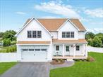 Located on a quiet cul-de-sac in the coveted south-of-the-highway Coastal Gem neighborhood of East Morichesâ€”just 70 miles from NYC and 6 miles to Westhampton Beach Villageâ€”this roomy and charming newer home, built in 2023, offers the perfect balance of modern design, smart features, and relaxed coastal living. Set on 1.01 acres and built with solid 2x6 construction, the home features a welcoming front porch that sets the tone for the ease throughout. Inside, a welcoming foyer opens into the heart of the home: a dramatic great room with soaring double-story ceilings, a gas fireplace, and abundant natural light pouring in through oversized windows. The open-concept design creates seamless flow, while still giving each space its own defined purpose. Off the foyer is a mudroom that provides a practical transition space and connects directly to the attached two-car garage. The kitchen, just beyond the great room, is beautifully outfitted with BOSCH appliances, quartz countertops, a center island, pot filler, and wine refrigerator. A large dining area sits adjacent, with sliding glass doors that lead out to a spacious back deck and fully fenced yard with a brand-new 20x40 heated poolâ€”ideal for entertaining or relaxing in privacy. The first-floor primary suite offers a quiet retreat with a spa-style bath featuring a soaking tub and a custom-designed walk-in closets. A powder room completes the main level. Upstairs, a wide staircase opens to a sunny den with peaceful green views of the cul-de-sac and a half-wall overlooking the great room below. This floor also includes three generously sized bedrooms, a full bathroom, a dedicated home office, and a separate laundry space.. Throughout the home, white oak floors add warmth and continuity, and all closets are custom-outfitted for maximum functionality. Additional highlights include Andersen 400 Series windows and doors, two-zone central air, a 6.5-foot-height basement for storage, a full attic with third-floor potential, an irrigation system, Ring security with three cameras, and solar panels with Tesla battery backup. With quality craftsmanship, thoughtful layout, and an easy coastal design sensibility, this home is a rare opportunity in one of the most authentic and peaceful seaside communities.