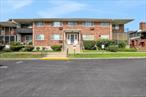 Welcome to this spacious and sun-filled 2-bedroom, 1-bath condo offering 1, 260 square feet of comfortable living in the desirable Kingswood Gardens community. This upstairs unit features an inviting galley kitchen with plenty of natural light, leading to a private outdoor balcony perfect for morning coffee or evening relaxation. The enormous living room showcases beautiful hardwood floors, creating a warm and welcoming atmosphere.Both bedrooms are generously sized, offering ample closet space, while the full bath is tastefully tiled for a clean and modern look. Additional highlights include two designated parking spaces for convenience and peace of mind. The HOA covers heat, hot water, and trash removal, and residents can enjoy access to a well-maintained community pool.Perfectly situated for commuters, this home combines comfort, convenience, and great amenities in a sought-after location.