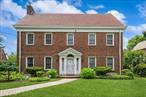 Stately All-Brick Center Hall Colonial on an oversized 95x120 sq ft lot in prestigious Jamaica Estates area. 4 full levels of living space includes a gracious foyer opening to a large living room with wood-burning fireplace and gleaming hardwood floors which are throughout. Formal dining room, spacious eat-in kitchen, sunlit family room, and main-level powder room. The 2nd floor offers 4 bedrooms & 3 full bathrooms. The 3rd level features 2-ensuite bedroomsâ€”ideal guest, in-law, or office suites. The full finished basement provides flexible recreation/media/fitness space, a wet bar, storage room, boiler room, laundry room and a half bath. In addition, large private backyard, 2-car garage, Central Air throughout and prime block close to transportation, houses of worship, and local amenities. A rare opportunity in Jamaica Estatesâ€”space, prestige, and classic architecture await!