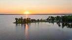 Incredibly rare gem on Oneida Lake! This spectacular offering is one of Oneida Lake&rsquo;s largest privately held frontages. Boasting 2, 500â€™ of unparalleled shoreline with an ideal cove for boats along the Eastern shoreline and tranquil walking and wading along the Western shore. No other site on the entire lake provides the tranquility and unobscured splendor of Lakefront living that this property- locally known as Lewis Point- offers. Set in a picturesque, park-like landscape, the grounds include manicured lawns, a charming pavilion, and a clubhouse that evokes the charm of simpler times. Itâ€™s the perfect setting to enjoy both breathtaking sunrises and unforgettable sunsets. The current owners have enjoyed their time of stewardship and are ready to welcome the next generation to enjoy and care for this gem as they have. The property is connected to public water and sewer, with the potential for a single, private estate, mixed-use with home and event space, or others as allowed by town. The existing RV campsite offers the potential for income generation.