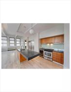 This spacious 1, 357 sq ft 2-bedroom, 2-bathroom loft at 55 Berry Street, Apt 4F in Williamsburg, features soaring 13-foot ceilings, original beams, and oversized windows, offering abundant natural light. The open-concept kitchen is equipped with granite countertops, marble-tiled bathrooms, and stainless steel appliances, including a Sub-Zero refrigerator and wine fridge. Additional amenities include hardwood floors, soundproof windows, a washer/dryer in-unit, and access to building facilities like a doorman, elevator, fitness center, communal terrace, and roof deck. Conveniently located near the G train at Nassau Ave and the L train at Bedford Ave, with numerous grocery stores, shopping, restaurants, and bars within a two-block radius. Experience the vibrant city life without the typical hustle and bustle, with weekend relaxation options like the farmers market at McCarren Park.