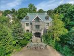 Luxurious 6-Bedroom Estate with Unrivaled Hudson River ViewsPerched atop a private bluff with sweeping, unobstructed views of the majestic Hudson River, this exceptional 6-bedroom, 7-bath estate redefines luxury living. Situated on .77 acres of meticulously landscaped grounds, the property exudes elegance from the moment you arrive, welcomed by a stately circular driveway and timeless architectural design.Inside, discover a harmonious blend of grandeur and comfort, where expansive open-concept living spaces are tailored for both lavish entertaining and relaxed everyday life. Walls of glass invite natural light and panoramic river vistas into nearly every room.Each of the five generously sized bedrooms features a private en-suite bath, offering a personal sanctuary for every resident and guest. The primary suite is a true retreat, boasting breathtaking river views, a spa-inspired bathroom, and custom walk-in closets.Premium features and amenities include:â€¢ An Endless Pool&#174; swim system for year-round aquatic fitnessâ€¢ Full generator backup powerâ€¢ 6-zone central air conditioning and dual heating systems for optimal comfortâ€¢ Two elegant fireplacesâ€¢ Rich mahogany wood finishesâ€¢ Sleek porcelain and marble flooring throughoutâ€¢ Multiple outdoor terraces, formal gardens, and a variety of serene spots for al fresco entertainingWhether hosting under the stars or enjoying a peaceful morning coffee with river views, every corner of this residence reflects refined taste and serene living.This is a rare opportunity to own a distinguished estate in a one-of-a-kind setting, where luxury, nature, and sophistication meet.