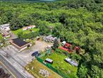 Prime Commercial Property for Sale - Marlboro/Highland, NY. Location, Visibility, and Versatility in One Package! This renovated commercial gem offers exceptional visibility and high traffic exposure, located directly across from a bustling gas station and just minutes from the popular Rocking Horse Ranch Resort. Whether you&rsquo;re looking to expand your business footprint or invest in a high-potential location, this property delivers. Property highlights include the fully renovated building with modern updates throughout that&rsquo;s ready for immediate use, the three spacious bay garage that&rsquo;s ideal for storage, automotive use, workshop, or flexible commercial operations, ample parking for customers, staff, or fleet vehicles, and a strategic location across from a high-traffic gas station. All of this is located only 5 miles from the NYS Thruway (I-87) and the Mid-Hudson Bridge, and only minutes away from Rocking Horse Ranch, a major tourist destination. This property is suitable for a wide range of commercial uses with easy access to major routes. This commercial property offers exceptional versatility for a wide range of businesses, from automotive repair and detailing services to contracting operations, retail showrooms with integrated storage, or investment opportunities with strong rental potential.
