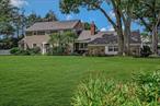 Welcome to 2 Winchester Lane, a captivating Rasmussen Colonial nestled in the serene setting of Huntington, NY. This exquisite home offers 5 bedrooms and 5 bathrooms on a sprawling .67-acre lot, enveloped by mature landscaping and featuring a beautiful heated in-ground pool (IGP), perfect for both relaxation and entertaining. Step inside to discover a beautifully renovated chef&rsquo;s kitchen, the heart of the home, boasting a high-end Viking range with a convection oven, as well as a commercial-sized SubZero refrigerator and freezer. The kitchen&rsquo;s breakfast nook features an inviting island and a cozy wood-burning fireplace, creating an ideal setting for morning gatherings. Off the kitchen, the oversized den invites you through French doors to a stunning brick patio, complete with a Tiki Bar and access to the private pool area. This outdoor haven is perfect for hosting gatherings or enjoying tranquil moments in your own private retreat. The interior maintains an elegant flow, featuring a formal dining room for special occasions and a sophisticated living room with another wood-burning fireplace, ideal for cozy evenings. The upper levels offer a spacious primary suite with double closets and a spa-like en-suite bathroom. A versatile room across the hall can serve as a sitting area, dressing room, or an additional bedroom. Two more bedrooms and a full bathroom are found on the second level, while the third floor provides two additional bedrooms or an optional home office, along with another full bathroom.Additional features include ample storage in the partial walk-up attic, an expansive family room with custom built-ins on the lower level with door to rear yard, a convenient laundry room, and a partial basement for utilities and extra storage. Located just minutes from Huntington Harbor, this classic Colonial home seamlessly combines traditional elegance with contemporary amenities, making it a perfect sanctuary for those seeking both charm and convenience.
