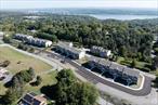 Only 2 units left! Located in the Scenic Hudson Valley, discover Marlboro&rsquo;s newest 2025 custom-built tri-level townhomes, these 24 units are crafted to meet all your expectations. Marlboro on Hudson Condominiums. Experience modern living at its finest in this bright and spacious 1850+ sq ft, 3 bedroom, 2.5 baths with central air. Enjoy all access to onsite amenities: clubhouse, fitness center, inground pool, pet friendly dog, grills and picnic areas. With the meticulously designed open concept on the first floor, this enables a comfortable and relaxing atmosphere for family gatherings. Enjoy an EIK to a private deck, granite countertops, large island, pantry and stainless-steel appliances, which flows into a large dining room, family room and half bath. Step upstairs to find a primary ensuite, 2 walk in closets, double vanities, walk in shower and a linen closet. There are 2 other bedrooms and another full bath with the convenience of a separate laundry room with a washer and dryer. To complete this home, there is a private driveway to a 1 car garage, an EV charging hook-up, with plenty of storage in the full unfinished walk-out basement. Delight in this charming hamlet just minutes from local wineries, hiking trails and riverfront for boating and fishing. Commuters will love this proximity to major highways and nearby metro north, approximately 75 miles from NYC. Enjoy the perfect blend of comfort, style and practicality!