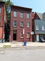 OUTSTANDING MULTI-FAMILY INVESTMENT PROPERTY, Brick building with three units in good condition, well-maintained, and updated rental licenses. Steps away from the waterfront, this property features good-paying tenants, numerous upgrades, a nice backyard, solid income, and separate utilities. Tenants are responsible for paying for gas and electricity. The two vacant apartments are easily accessible for showings.