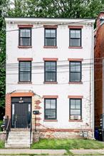 Perched above the Hudson, this thoughtfully renovated two-family home offers sweeping river views from every level. Located in Newburghâ€™s historic district, the property features a bright garden-level studio with direct backyard accessâ€”perfect for guests, tenants, or creative use.Upstairs, a spacious and sun-filled duplex spans two floors, offering three bedrooms, a private entrance, a large deck, and panoramic views that shift with the seasons. Recent upgrades include a new roof, updated mechanicals, and a tasteful restoration of original architectural details.Whether youâ€™re seeking a live-with-income opportunity or a flexible townhome layout, this is Hudson Valley living with both character and upside.