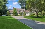 Ideally located on a generous 100 x 251-foot lot in the highly sought-after Central Section of Garden City, this stunning Colonial offers an impressive blend of space, elegance, and comfort. Featuring 5 bedrooms and 3 full bathrooms, the home is thoughtfully designed for both everyday living and stylish entertaining.The welcoming entrance foyer leads to an elegant formal dining room and a gourmet kitchen, complete with custom cabinetry, premium appliances, a center island, and a sunlit breakfast area. The kitchen flows seamlessly into a bright and airy family room with a cozy fireplaceâ€”perfect for gatherings. A formal living room with a second fireplace, a versatile bedroom or home office, and a full bath complete the main level.Upstairs, the spacious primary suite includes a private dressing or sitting room, while three additional well-proportioned bedrooms share a hall bathroom. The finished basement extends the living space with a large recreation room, a dedicated office, and a generous laundry and storage area.Outside, the beautifully landscaped, fenced-in backyard is a true sanctuary. Mature plantings create a lush, private atmosphere, complemented by multiple outdoor living areas: a brick paver patio with a fireplace and jacuzzi, a dedicated barbecue zone, and a serene bluestone patioâ€”ideal for entertaining or unwinding in style. The property could easily accommodate an in-ground pool. A charming bluestone-covered breezeway connects the home to a 2-car garage with attic storage. Located just minutes from shopping, dining, and the Garden City LIRR station, this home combines convenience with luxury. With its prime location, spacious layout, and exceptional condition, this property is a rare find and an incredible place to call home.