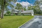 Renovated 6-Bedroom Hampton-Style Home in The Gates of WoodburyTurnkey living awaits at this stunning, recently renovated 6-bedroom, 3.5-bath, Hampton-style home offering a versatile layout designed to meet a variety of needs. Set in The Gates of Woodbury and located within the Syosset School District with Walt Whitman Elementary School, the main level features a spacious entry foyer with closet, formal living and dining rooms, and an expansive, renovated light-filled kitchen, perfect for todayâ€™s lifestyle. Direct access to the expansive patio creates a seamless indoor-outdoor flow. A functional and spacious mudroom provides convenient everyday entry and organization.Two wood-burning fireplacesâ€”located in the living room and denâ€”add warmth and beauty while providing natural gathering and entertaining spaces. Three bedrooms are located on the first floor, including a private Primary suite. Three additional bedrooms upstairs offer flexibility for guests, work, or additional household members. The spacious and numerous closets and abundant storage provide a place for everything.Situated on a beautiful, flat, 1-acre, the property is filled with mature landscaping providing privacy.Optional TOBAY Beach membership available (dues required).