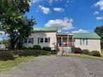 New to the market! This four bedroom ranch style bungalow is situated on 1.3 acres in the Minisink Valley School District. There is an eat in kitchen, spacious living room, tin roof, plus front and back covered porches. In addition, there are two out buildings. The garage structure has a dirt floor and is great for storage. The other outbuilding is a pole barn that has endless possibilities. Picturesque setting and a large back yard. Minutes to school campus, local town park and recreational areas, dining, shopping, medical facility, farmers markets, Legoland and much more. Commuter distance to NYC.