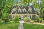 First time on the market in 65 years! Welcome to 19 Mountain Aveâ€”a cherished, beautifully maintained home tucked behind stone walls on one of Larchmontâ€™s most picturesque and desirable streets. Set on just under a quarter acre, this special property offers the perfect blend of charm, privacy, and locationâ€”just moments from the train, vibrant village shops, restaurants, and top-rated schools. From the moment you arrive, the curb appeal is undeniable. Stone terraces and mature landscaping frame the home, inviting you to sip your morning coffee on the front porch as the neighborhood begins to stir. Step inside to a gracious foyer that opens into a sun-drenched, oversized living roomâ€”anchored by a massive wood-burning fireplace and framed by three exposures that fill the space with natural light. Just off the living room, a stunning stone-walled studyâ€”also with three exposuresâ€”offers a cozy and inspiring retreat. Continue on to the heart of the home: an open-concept kitchen and dining area, updated in late 2019 with quality cabinetry, a porcelain tile backsplash, and generous counter space. Morning sunlight pours in through the kitchen window, making the space feel bright and welcoming. Beyond the kitchen lies a versatile den, along with a cleverly designed full bathroom disguised as a powder roomâ€”open the lower base cabinetry and youâ€™ll uncover a hidden tub. Red oak hardwood floors run throughout the homeâ€”even beneath the kitchenâ€™s current flooring. Upstairs, the expansive primary suite is a true retreat with three exposures, a private bath, and a bonus room ideal for a nursery, office, or dressing area. Two additional bedroomsâ€”one of which also enjoys three exposuresâ€”share a full hall bath. A walk-up attic provides incredible potential for finishing or simply enjoy it as abundant storage. The walk-out lower levelâ€”once a photography studioâ€”offers flexible space for a playroom, gym, or creative studio, as well as a large laundry/storage area and direct access to the attached two-car garage. Perfectly positioned in a serene, leafy pocket of Larchmont- It stands as a rare opportunity to own a property full of warmth, character, and endless potential in a truly desirable locale.