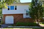 Come make this house yours! The upper level boasts 2 bedrooms with good size closets,  living room with hardwood floors, an eat-in kitchen and dining room, Downstairs, the lower level offers an outside entrance,  additional living space: 2 bedrooms, eat in kitchen, living room and dining room,  Washer and Dryer for each floor, hardwood floors need to be re-finished, large property.