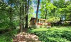 On the lakeside of Smallwood, this 3 season cottage has 2 bedrooms and 1 full bath. Low taxes and very affordable for this popular lake community. Open kitchen and living room, enclosed porch and back den room for overflow guest space, yoga, art room or office. Electric baseboard heat in bedrooms and wall propane space heater in living room. Nice layout and fully furnished. Decks in front and back yard, 2 driveways, 200 amp electric and large crawl space under home for plenty of storage for boats and outdoor furniture. 3 season homes are very popular as there are no electric, cable, internet, water or heat costs in winter months. Great location to ride your bike or walk to the waterfall and lake. No HOA. Homeowners have the option to join the Civic Association for lake membership that includes the Smallwood Civic Park, clubhouse and plenty of scheduled events. Sandy beach for swimming, non-motor boating and fishing. Play pickleball, tennis, basketball, soccer, baseball and new children&rsquo;s playground. Become a member of The Club at Smallwood for heated pool, club house and daily/nightly activities. Take the pup to the dog park and visit the Reserve at Smallwood for use of outdoor exercise equipment and hiking trails. Relax by the waterfall and take in the fresh country air. If you want more to do visit nearby Bethel Woods for concerts and festivals, Catskill Resorts World, Kartrite Waterpark, waterfront dining, antique shops, breweries and farmers markets. There is plenty to explore in Sullivan County with an abundance of mountains, lakes and rivers. Call to take the tour!