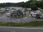 NEW WINDSOR - BRING YOUR BUSINESS HERE AT THIS LOCATION WITH SUPER HIGH VISIBILITY... NEXT TO DUNKIN&rsquo; DONUTS. ROUTE 9W STOREFRONT WITH PARKING...APPROXIMATELY 3900&rsquo; SQ. FT. IN TOTAL. 2700&rsquo; sq. ft. retail space on one level, one big open space with 13&rsquo; high ceilings, large glass windows on all three sides of the building provides plenty of 9W direct visual exposure, a 12&rsquo; high overhead door and a double 6&rsquo; glass door plus another 1200&rsquo; sq. ft. office space on 2 levels and small extra storage area. Bathroom on 1st floor. Second floor space has 9&rsquo; high ceilings with windows overlooking the showroom. Entire building has central air and forced air heat and plenty of natural sunlight and direct visibility from 9W.