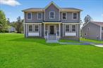 A top-tier Orange County NY builder brings his superior craftsmanship to this stunning new colonial in the Lake Louise Marie community. This 2, 300 square foot home offers four bedrooms, two and a half bathrooms, and a bright open floor plan designed with comfort and quality in mind. The layout also allows for a future 13x15 basement den.Thoughtfully upgraded throughout, this home features hardwood floors across both levels, elegant European-style tilework, a gas fireplace with a stone surround and decorative mantle, and solid wood cabinetry with crown molding. The kitchen is equipped with GE stainless steel appliances and the spacious primary suite includes a walk-in closet with built-in shelving.Additional highlights include a composite front porch, 12x12 rear deck, RING security doorbell, rain gutters, CertainTeed siding with PVC trim, concrete sidewalks, a two-car garage with automatic openers, and a landscaped lot with a retaining wall and tranquil brook in the backyard.Located in a peaceful setting with lake rights, this property includes access to a private non-motorized boat launch and two Emerald Green community centers offering pools, tennis and pickleball courts, basketball, a fitness center, and scenic trails. With limited new construction available in this area, this is a rare opportunity to own a brand-new home in a sought-after lake community.