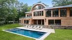 Welcome to 16 Col Sheldon, a newly completed and designer finished modern masterpiece set on four private acres in the heart of Pound Ridge. This stunning 5-bedroom, 6.5-bath home combines cutting-edge design with luxurious comfort, offering the ultimate in indoor-outdoor living.Step inside to soaring 23-foot ceilings and a light-filled open-concept layout, perfect for both everyday living and entertaining. The chefâ€™s kitchen is a showstopper, featuring a 48-inch Wolf range, Sub-Zero refrigerator, wine fridge, and seamless flow to the upper deck overlooking the picturesque property.Every bedroom is ensuite, including a separate guest or nanny suite with its own private living room. The lower level is an entertainerâ€™s dreamâ€”complete with a home theater, gym, office, and expansive lounge that opens directly to the pool area for effortless indoor-outdoor enjoyment.Sonos speakers throughout the home provide a fully integrated experience, while the beautifully landscaped grounds and sleek pool create your own private retreat just an hour from NYC.This is modern living at its finestâ€”thoughtfully designed, impeccably executed, and perfectly placed.