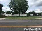 Vacant land on busy Middle Country Road at the corner of North Evergreen Dr. Buyers should contact Town to see what they can do with the property.
