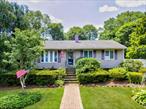 Welcome to this impeccably maintained and renovated 4-bedroom, 2-bath home in the desirable Comsewogue School District, nestled on a spacious third-acre lot in beautiful Port Jefferson Station. In diamond condition, this charming residence offers the perfect blend of comfort, function, and style.Step into a sunlit, open-concept living space featuring hardwood floors throughout, detailed crown moldings, and wainscoting. The large eat-in kitchen has a separate dining area, white cabinetry, abundant quartz countertops, and stainless steel appliances (gas cooking). Sliding glass doors off the kitchen lead to a large deck with an awning.The lower level features a perfect family room with a wood-burning fireplace, ideal for cozy nights and entertaining. There&rsquo;s also a guest bedroom, full bathroom, and a separate side entrance, offering potential for extended guest use or a home office setup.Additional features include pull-down attic access, 3-zone gas heating, Andersen windows, and through-wall AC units.Step out to your private outdoor oasis: a covered front porch, paved patio, deck with an awning, above-ground pool (new liner), fish pond, in-ground sprinklers (front & back), two large sheds, and the most incredible gardens youâ€™ve ever seen (Elvis will be leaving!). There is also ample driveway parking.Pride of ownership shines in every corner. This is not just a houseâ€”it&rsquo;s a lifestyle. Experience everything this turn-key home has to offer.